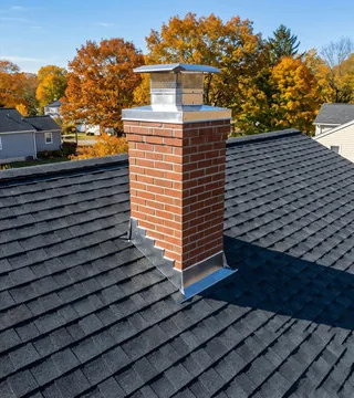 After: new brick chimney with a stainless cap and shining flashing